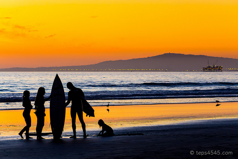 Surfer family on sunset